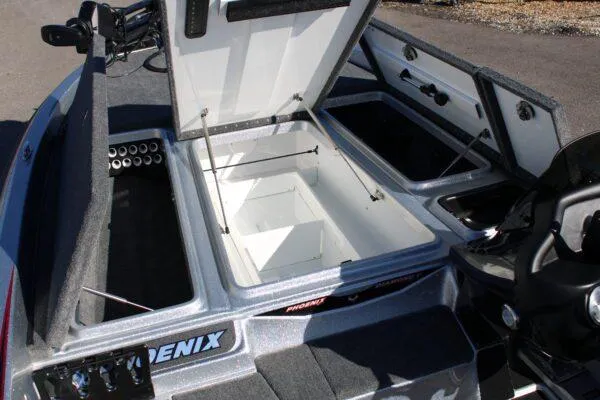 Slide: The Image of 2023 Phoenix 921 ELITE boat with open storage compartments and fishing rod holders. - 9