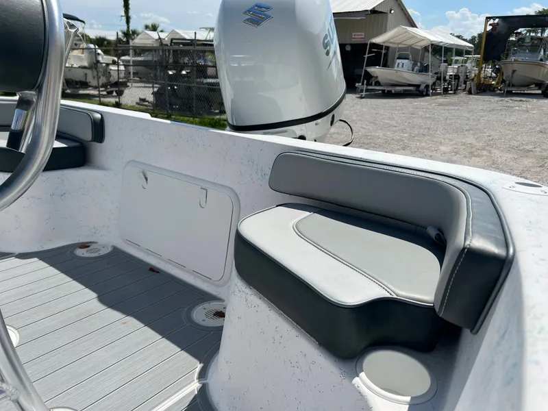 Slide: The Image of 2024 ALK2 Powerboats 18 CRS interior with seating and storage compartments. - 11