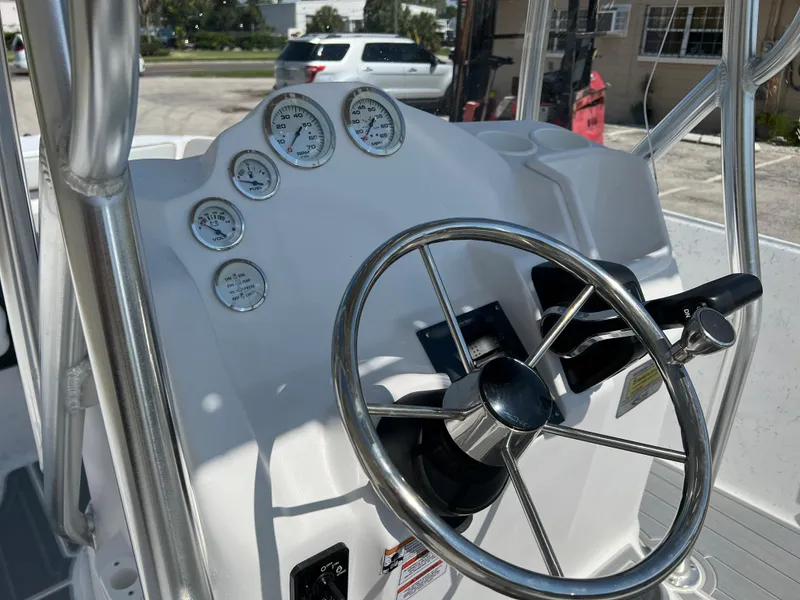 Slide: The Image of 2024 ALK2 Powerboats 18 CRS dashboard with steering wheel and gauges. - 15