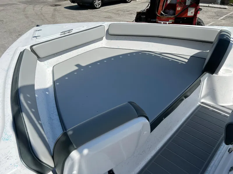 Slide: The Image of 2024 ALK2 Powerboats 18 CRS bow seating area with gray cushions. - 16