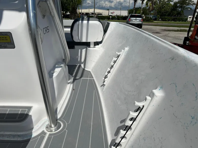 Slide: The Image of 2024 ALK2 Powerboats 18 CRS interior view, showcasing rod holders and sleek design. - 18