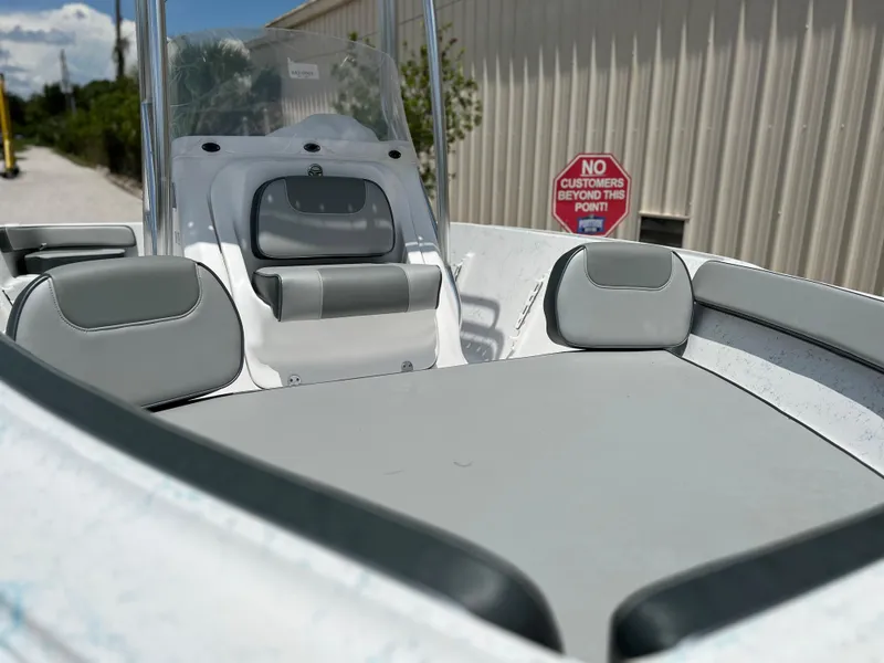 Slide: The Image of 2024 ALK2 Powerboats 18 CRS interior with gray seating and console. - 22