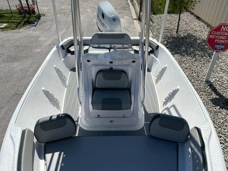 Slide: The Image of 2024 ALK2 Powerboats 18 CRS, center console, white and gray interior, docked. - 23