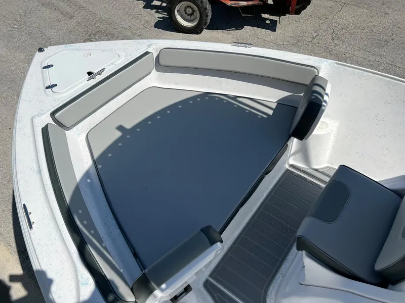 Slide: The Image of 2024 ALK2 Powerboats 18 CRS bow seating area with gray cushions. - 27