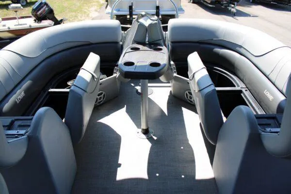 Slide: The Image of 2021 Lowe SS250 Super Sport boat interior with seating and table. - 11