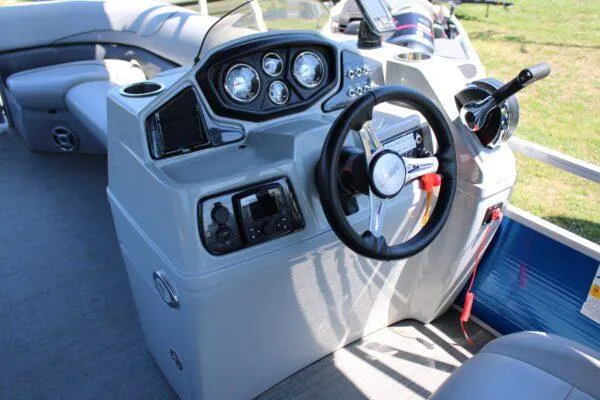 Slide: The Image of 2021 Lowe SS250 Super Sport boat console with steering wheel and control panel. - 7