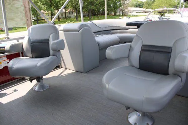 Slide: The Image of 2021 Lowe SS250 Super Sport boat interior with gray seating and steering console. - 10