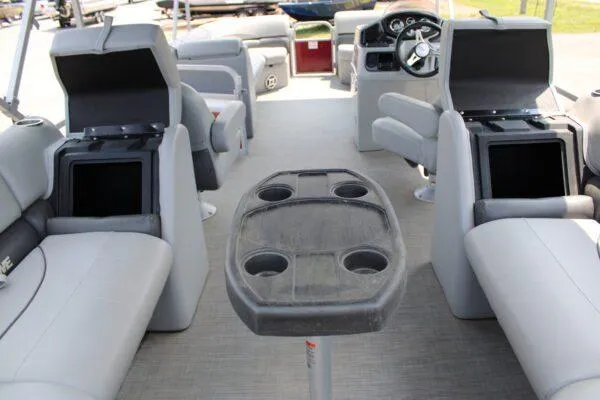 Slide: The Image of 2021 Lowe SS250 Super Sport pontoon boat interior with seating and storage compartments. - 14