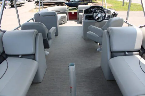 Slide: The Image of 2021 Lowe SS250 Super Sport pontoon boat interior with gray seating and steering console. - 4