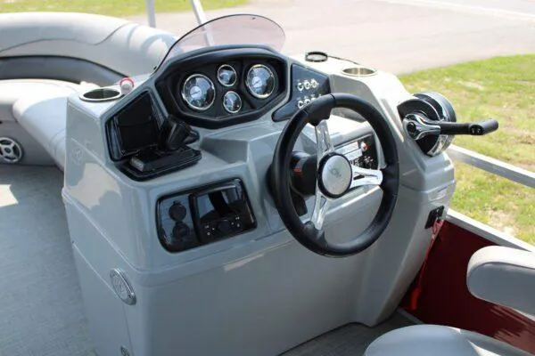 Slide: The Image of 2021 Lowe SS250 Super Sport boat dashboard with steering wheel and control panel. - 9
