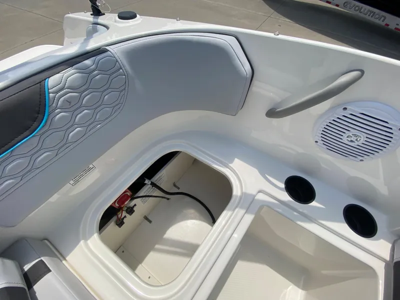 Slide: The Image of 2024 Bayliner Element M17 boat interior with storage compartment and speaker. - 12