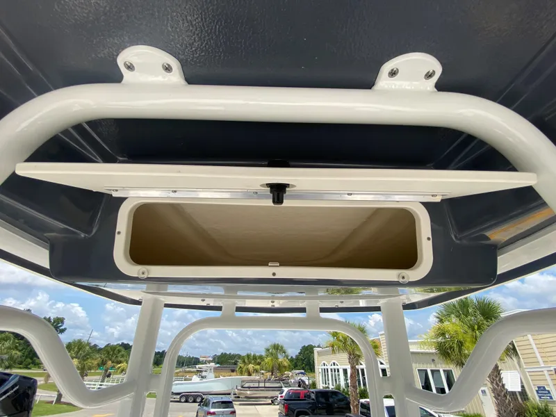 Slide: The Image of 2024 Robalo 226 Cayman boat storage compartment. - 13