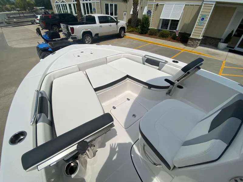 Slide: The Image of 2024 Robalo 226 Cayman boat interior with white seating and modern design. - 17