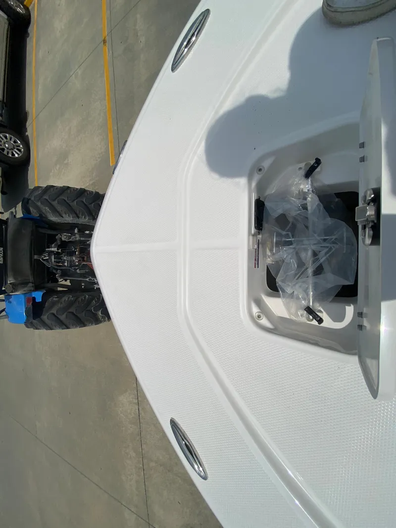 Slide: The Image of 2024 Robalo 226 Cayman boat bow with storage compartment. - 20