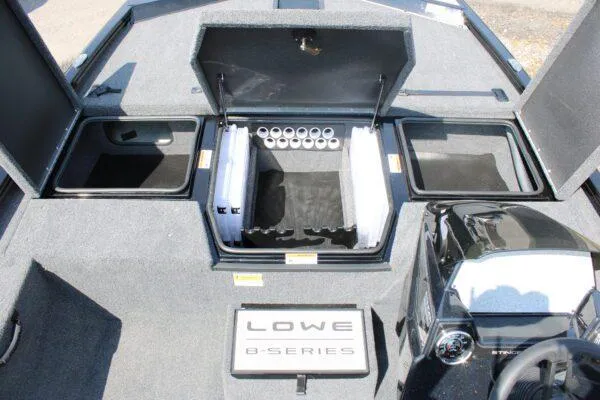 Slide: The Image of 2023 Lowe Stinger 178 boat interior with storage compartments and rod holders. - 3
