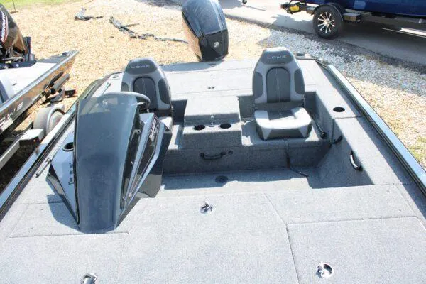 Slide: The Image of 2023 Lowe Stinger 178 boat interior with dual seats and steering console. - 4