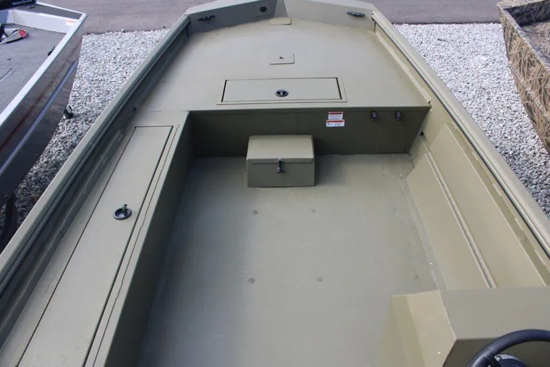 Slide: The Image of 2023 Lowe Roughneck 1860 Rambler boat interior with storage compartments. - 3