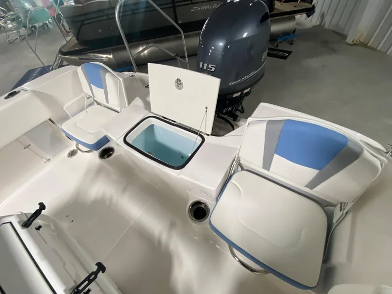 Slide: The Image of 2024 Robalo R180 Center Console boat interior with seating and storage compartments. - 8