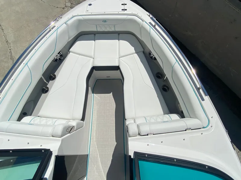 Slide: The Image of 2024 Regal LS6 boat interior with white seating and modern design. - 6