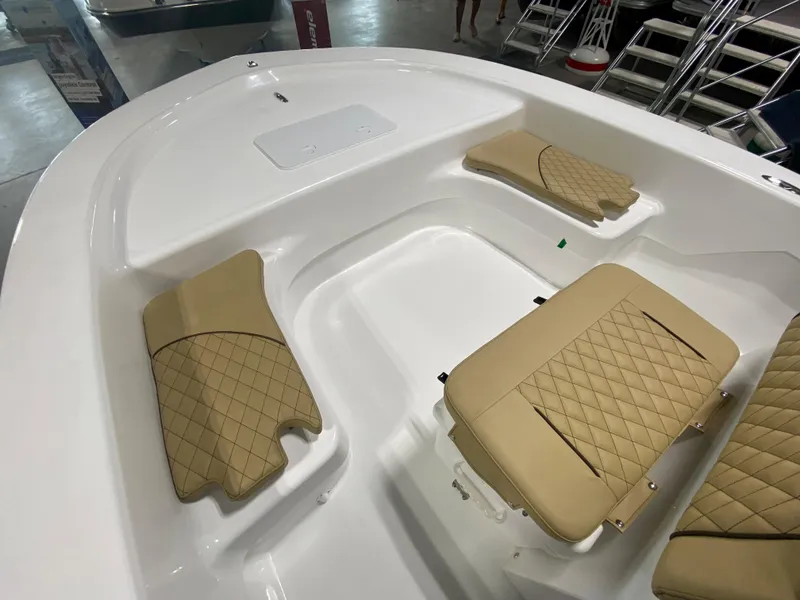 Slide: The Image of 2024 Savannah SS19 boat interior with beige diamond-stitched seating. - 14