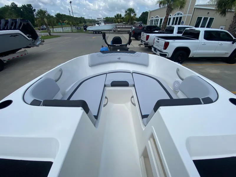 Slide: The Image of 2024 Bayliner Element M17 boat interior with seating and dashboard. - 15