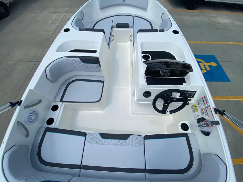 Slide: The Image of 2024 Bayliner Element M17 boat interior with seating and steering console. - 7