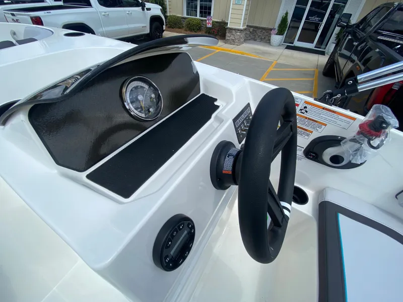 Slide: The Image of 2024 Bayliner Element M17 boat dashboard and steering wheel. - 9