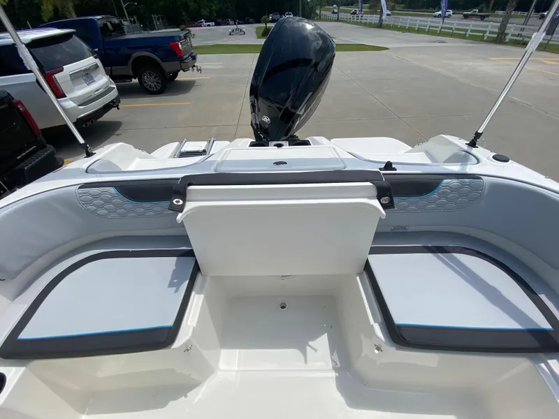 Slide: The Image of 2024 Bayliner Element M17 boat interior with seating and outboard motor. - 10
