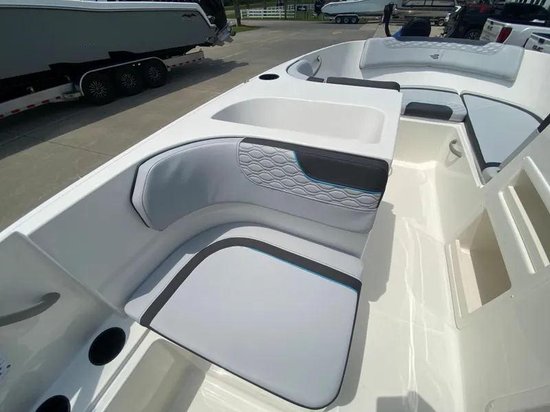 Slide: The Image of 2024 Bayliner Element M17 boat interior with cushioned seating and storage compartments. - 13