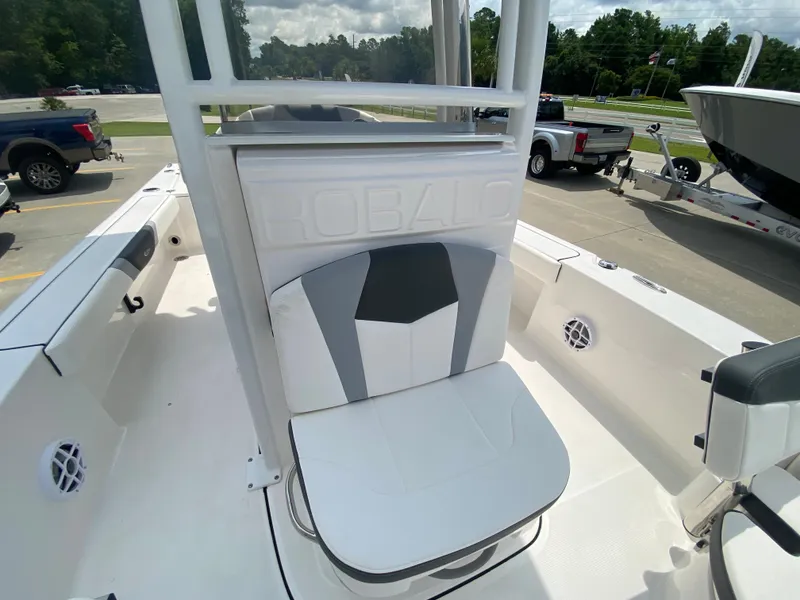 Slide: The Image of 2024 Robalo 226 Cayman boat interior with white and gray seating. - 14