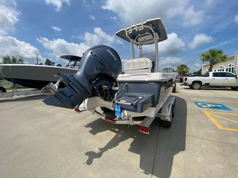 Slide: The Image of 2024 Robalo 226 Cayman boat with Yamaha outboard motor in parking lot. - 3
