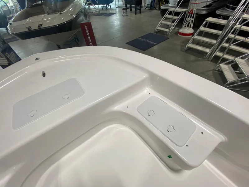 Slide: The Image of 2024 Savannah SS19 boat interior, white deck with storage compartments. - 16