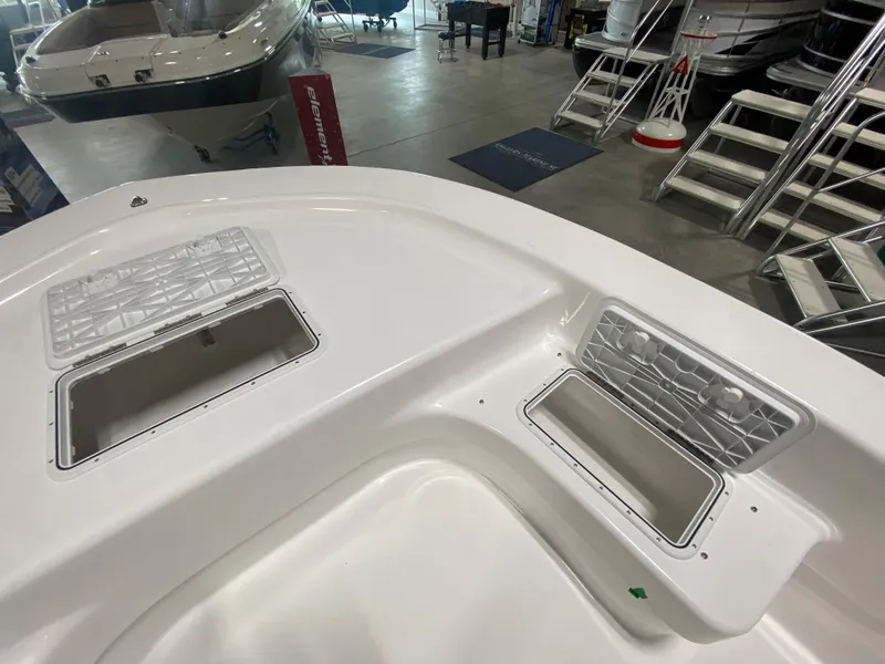 Slide: The Image of 2024 Savannah SS19 boat interior with open storage compartments in a showroom. - 18