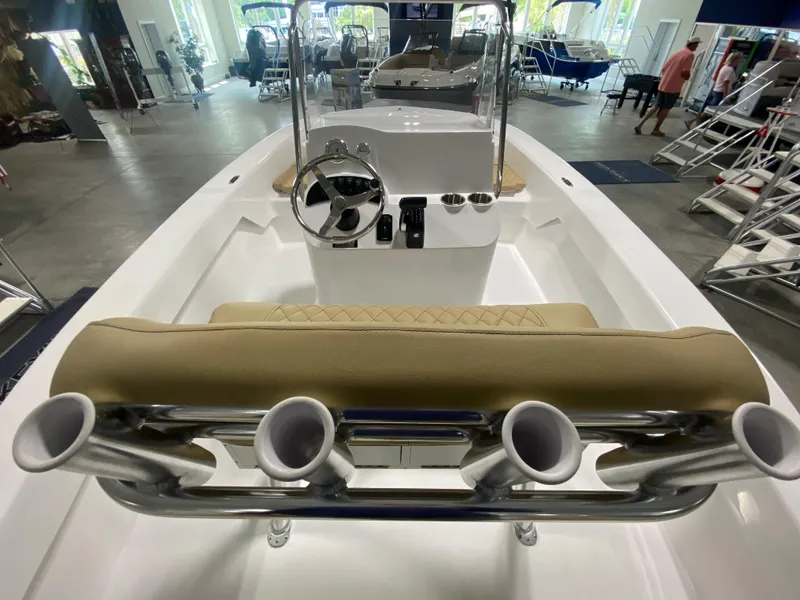 Slide: The Image of 2024 Savannah SS19 boat interior with steering console and rod holders. - 12