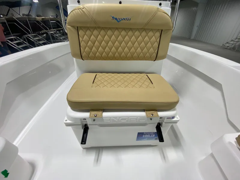 Slide: The Image of 2024 Savannah SS19 boat seat with tan upholstery and integrated cooler. - 15