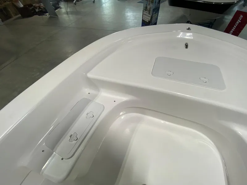 Slide: The Image of 2024 Savannah SS19 boat interior, white deck with storage compartments. - 17