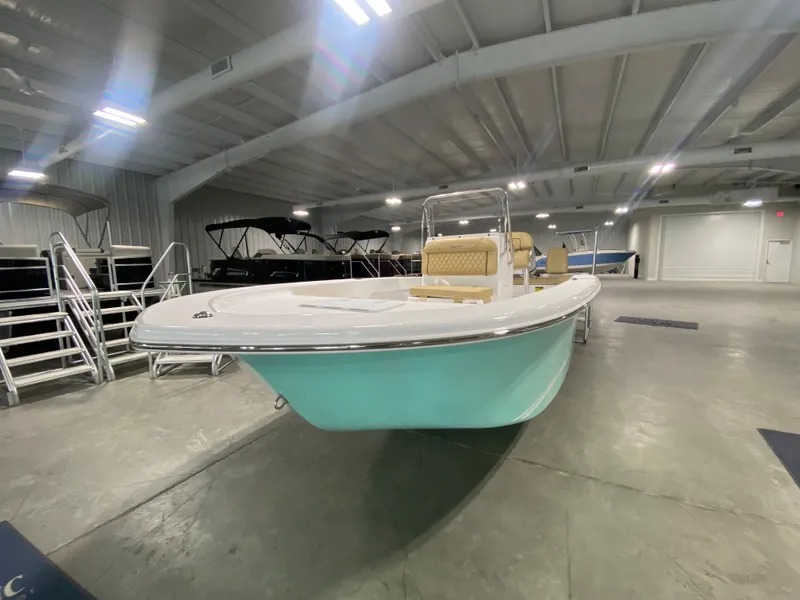 Slide: The Image of 2024 Savannah SS19 boat in showroom, front view. - 2