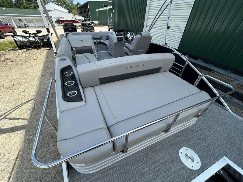 Slide: The Image of 2022 Bennington L25 pontoon boat with spacious seating and modern design. - 11