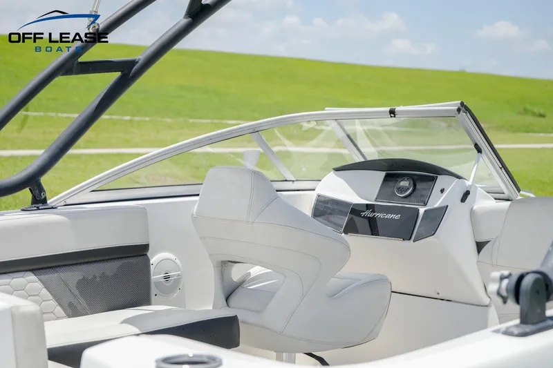 Slide: The Image of 2020 Hurricane 217 SD boat interior with steering wheel and seating. - 5