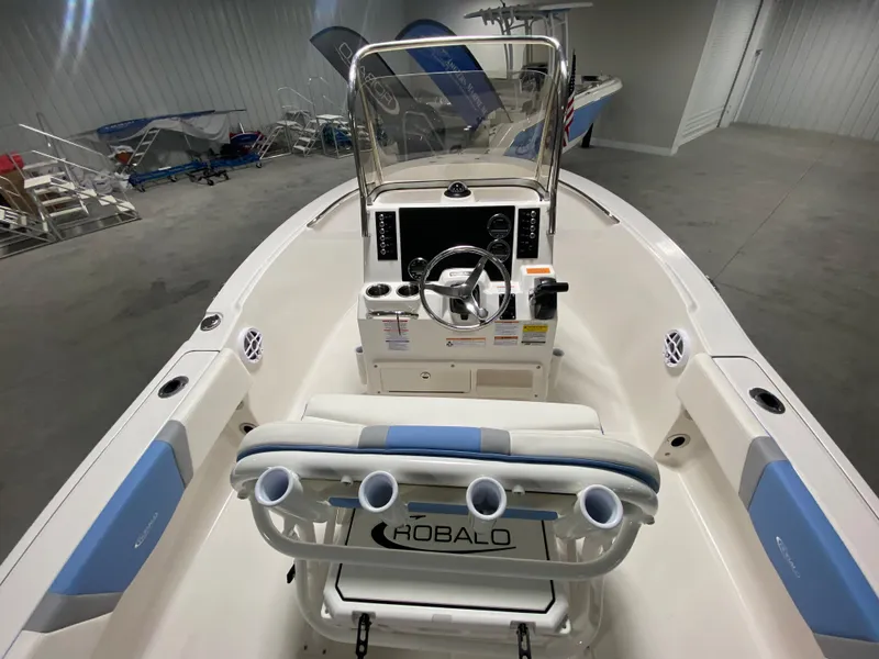 Slide: The Image of 2024 Robalo R180 Center Console boat interior with helm and seating. - 6