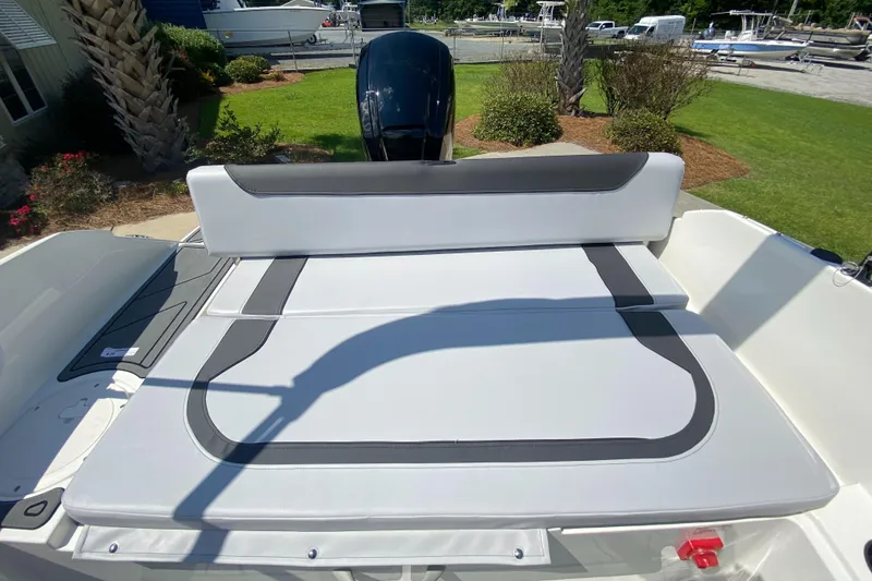 Slide: The Image of 2024 Bayliner Element M19 boat with spacious sun deck and outboard motor. - 14