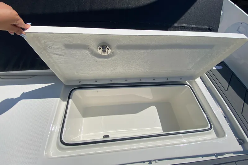 Slide: The Image of 2024 Bayliner Element M19 storage compartment with open lid. - 20