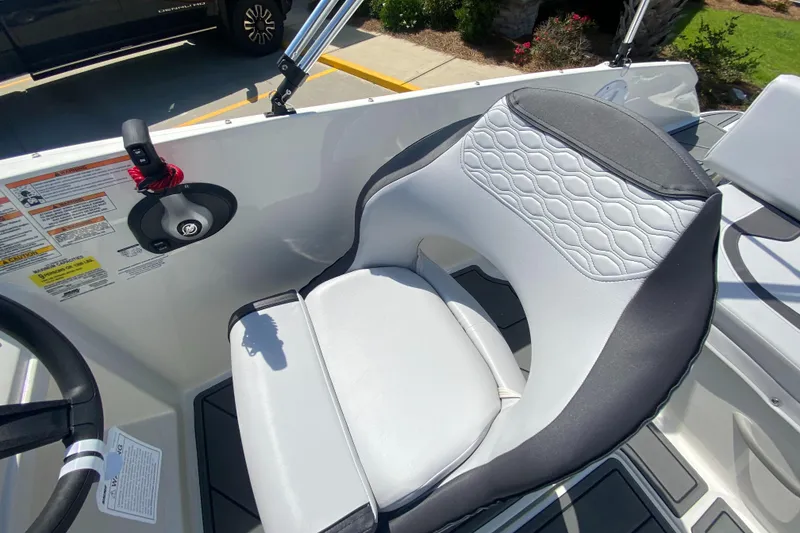 Slide: The Image of 2024 Bayliner Element M19 boat interior with a comfortable captain's chair. - 9