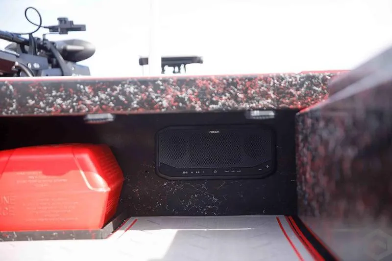 Slide: The Image of Go-Devil 2060 boat interior, featuring a red fuel tank and a mounted audio system, 2023 model. - 14
