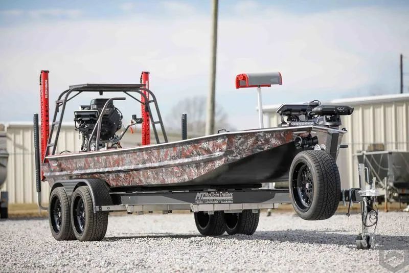 Slide: The Image of 2023 Go-Devil 2060 boat on a trailer, camo design, dual motors, and rugged build. - 15