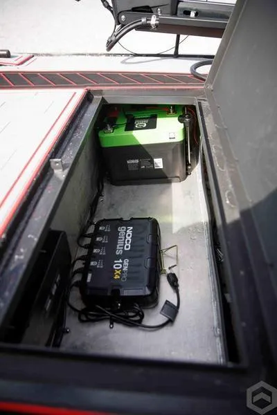 Slide: The Image of Battery compartment of a 2023 Go-Devil 2060 boat with NOCO Genius charger. - 18