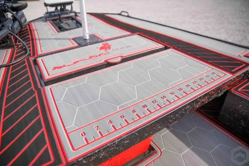 Slide: The Image of 2023 Go-Devil 2060 boat deck with hexagonal pattern and integrated measuring ruler. - 26