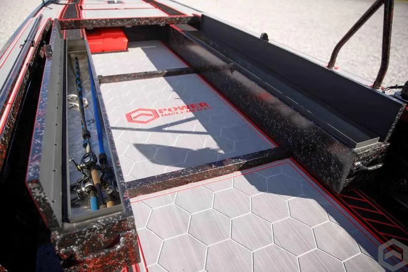 Slide: The Image of Go-Devil 2060 boat interior, 2023 model, featuring storage compartments and hexagonal patterned flooring. - 28