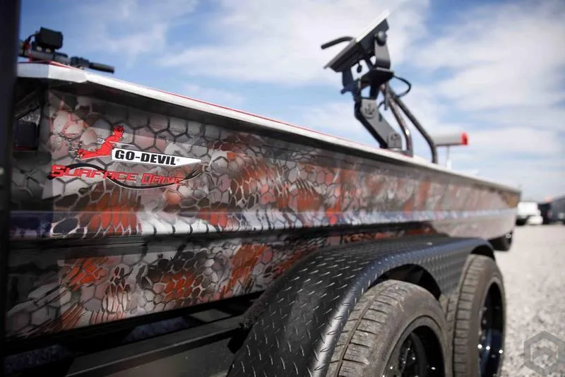 Slide: The Image of 2023 Go-Devil 2060 boat with camouflage design on trailer. - 6