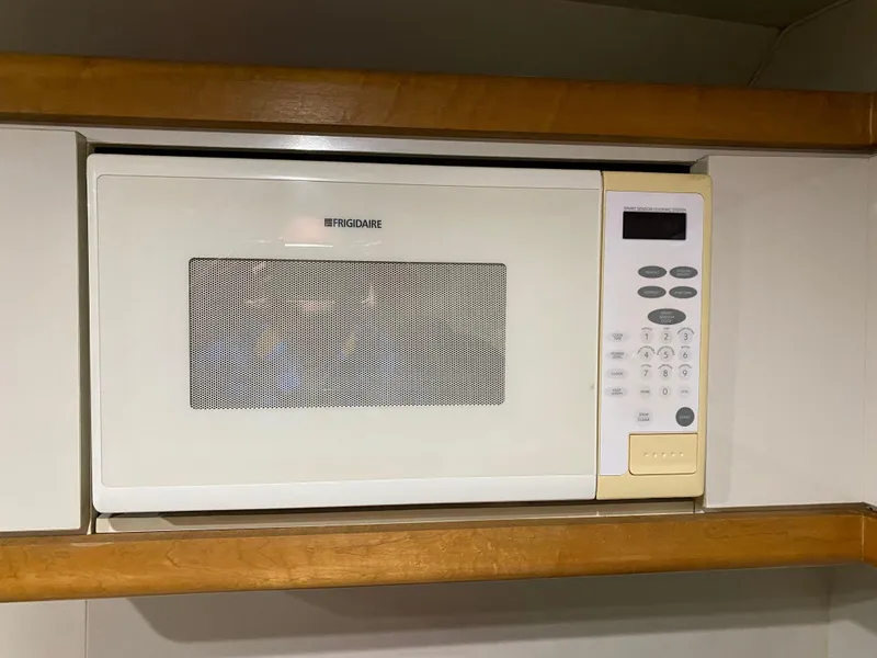 Slide: The Image of Frigidaire microwave installed in a 1996 Carver 390 Express yacht kitchen. - 10